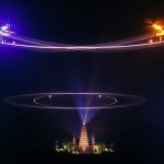 Dazzling drone light show patterns illuminate the Bali night sky.