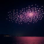 Drone show over Bali beach at night