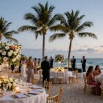 Luxury Bali wedding reception on a beach at sunset.